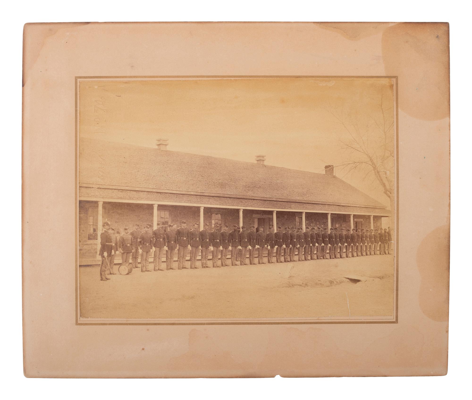 [LATE INDIAN WARS]. [MCKAY, William, photog., attrib.]. 2 photographs of US soldiers near barracks.