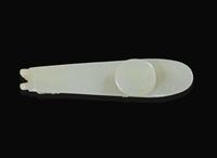 A Chinese carved pale celadon jade belt hook, Qing dynasty 青玉帶鉤 清