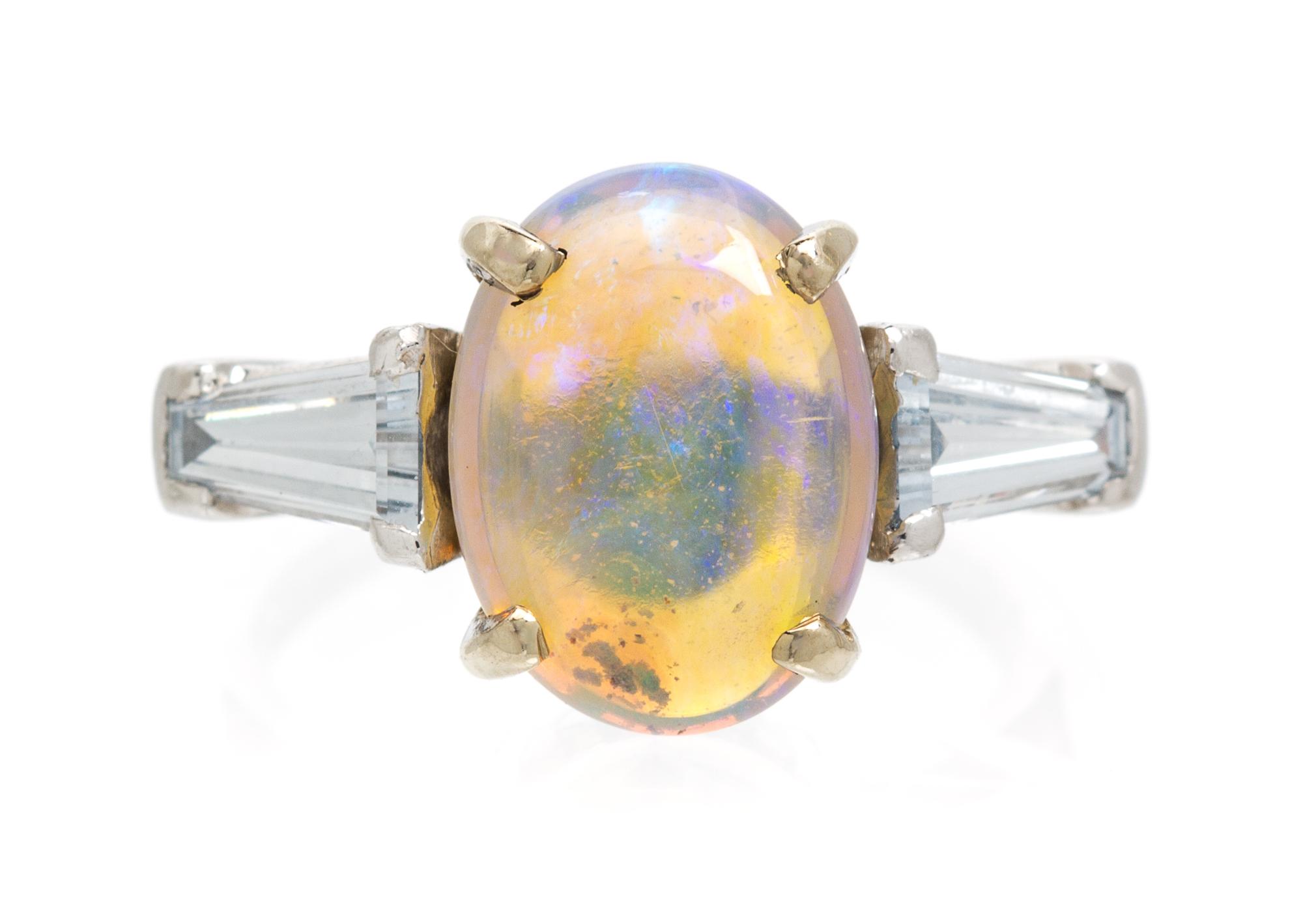 A Platinum, Opal and Diamond Ring, Peacock, 4.20 dwts.