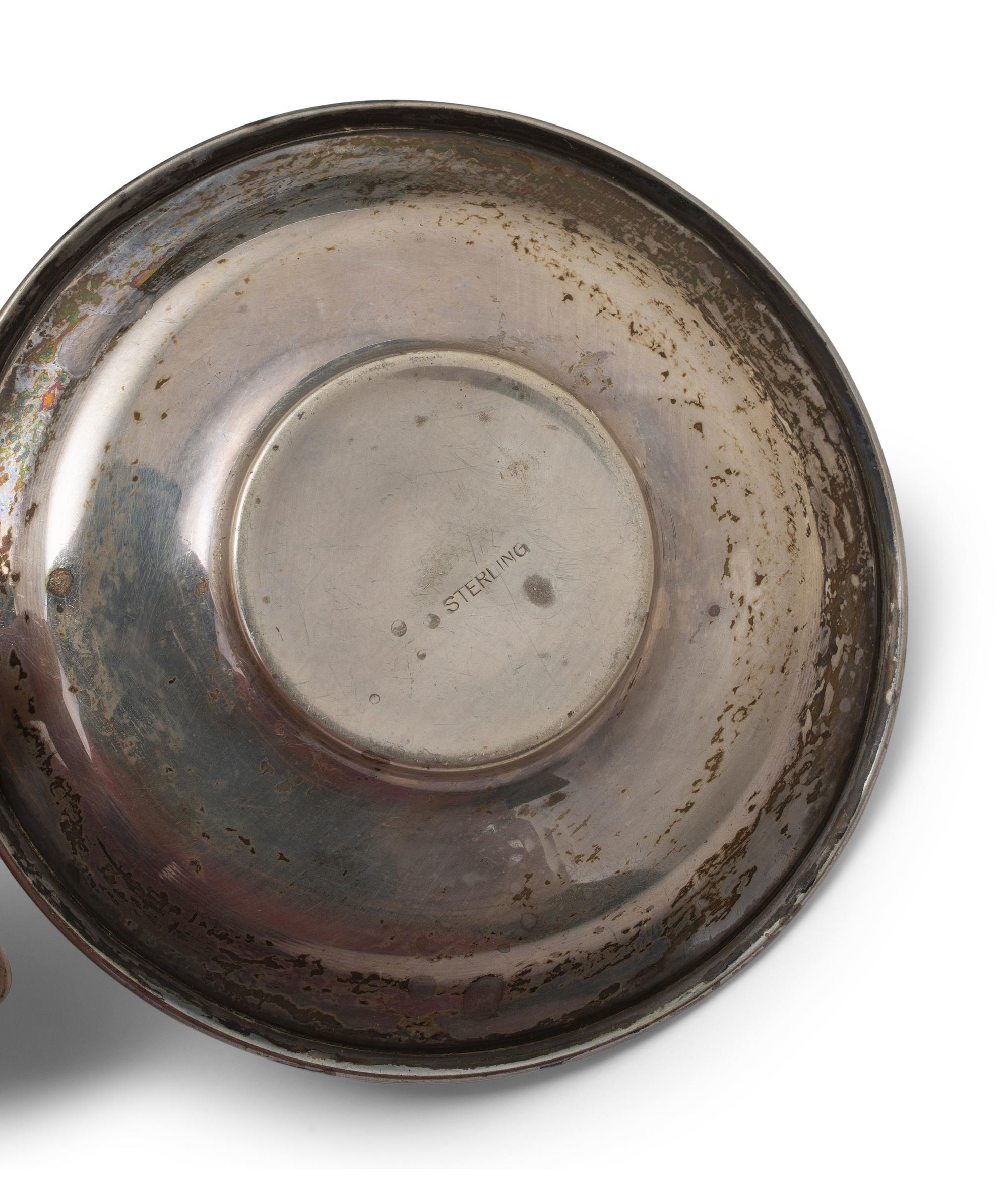 A Set of Twelve American Silver Coffee Cups and Saucers
