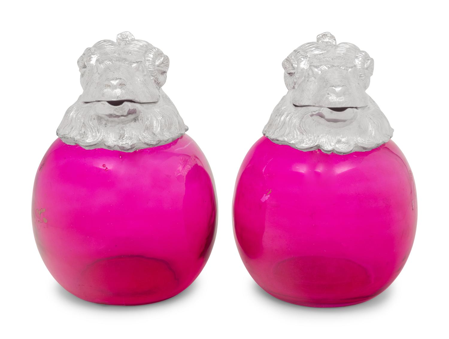 A Pair of Silver-Plate and Pink Glass Ram Decanters
