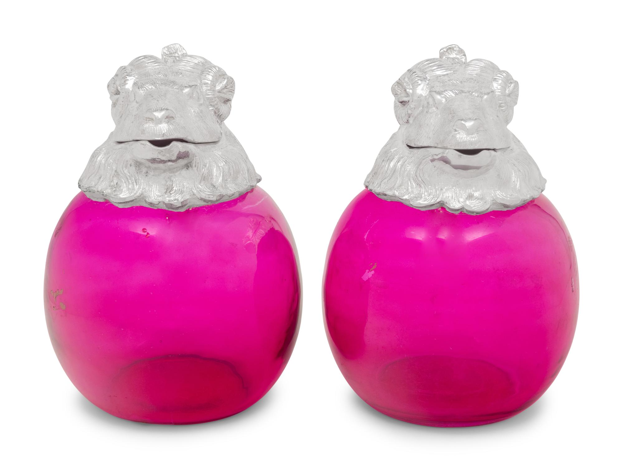 A Pair of Silver-Plate and Pink Glass Ram Decanters