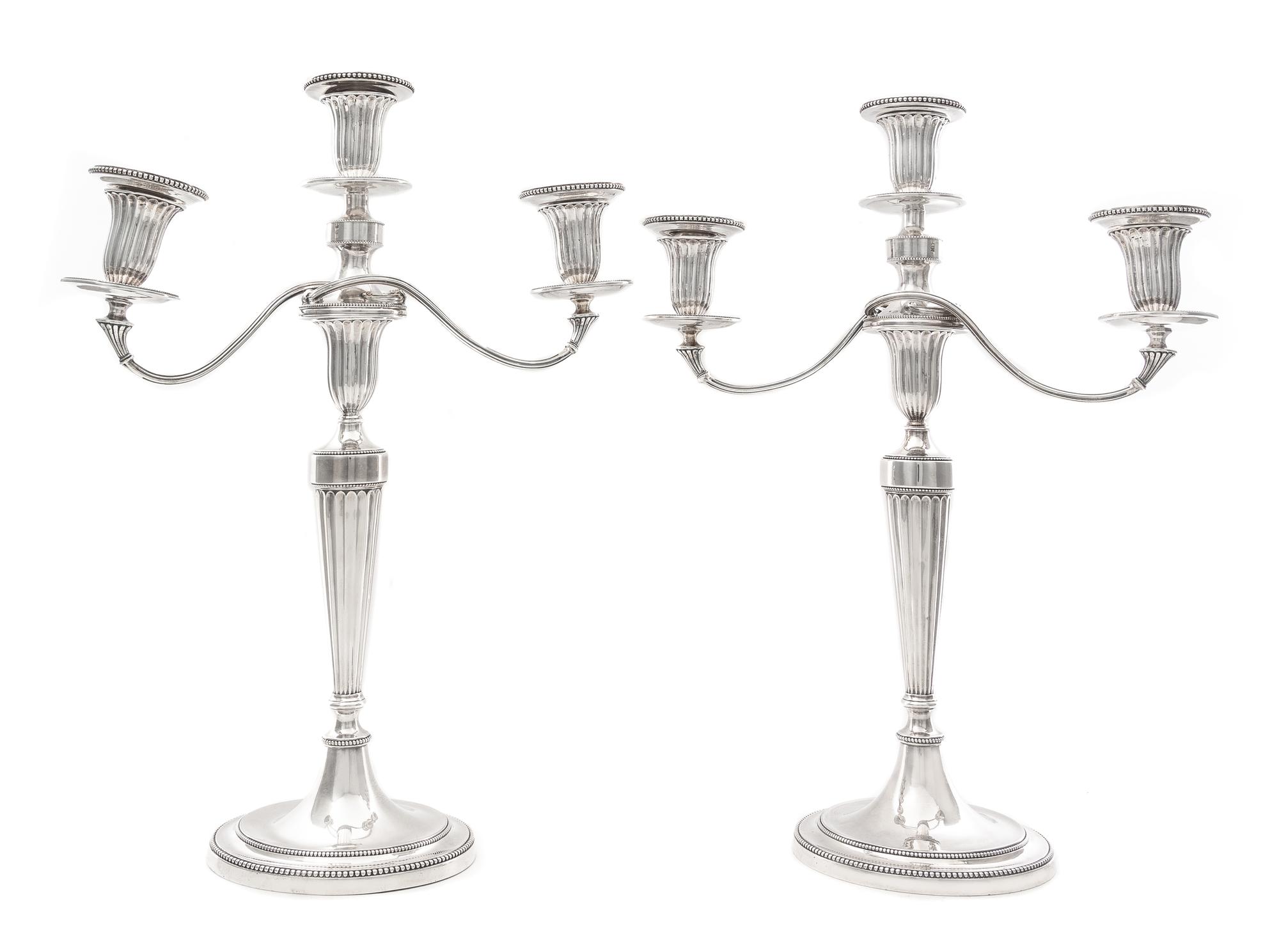A Pair of George III Silver Three-Light Candelabra, John Schofield, London, 1781; the Branches Marked for 1796, each fluted tapering st