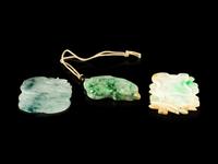 Three Chinese Carved Jadeite Pendants