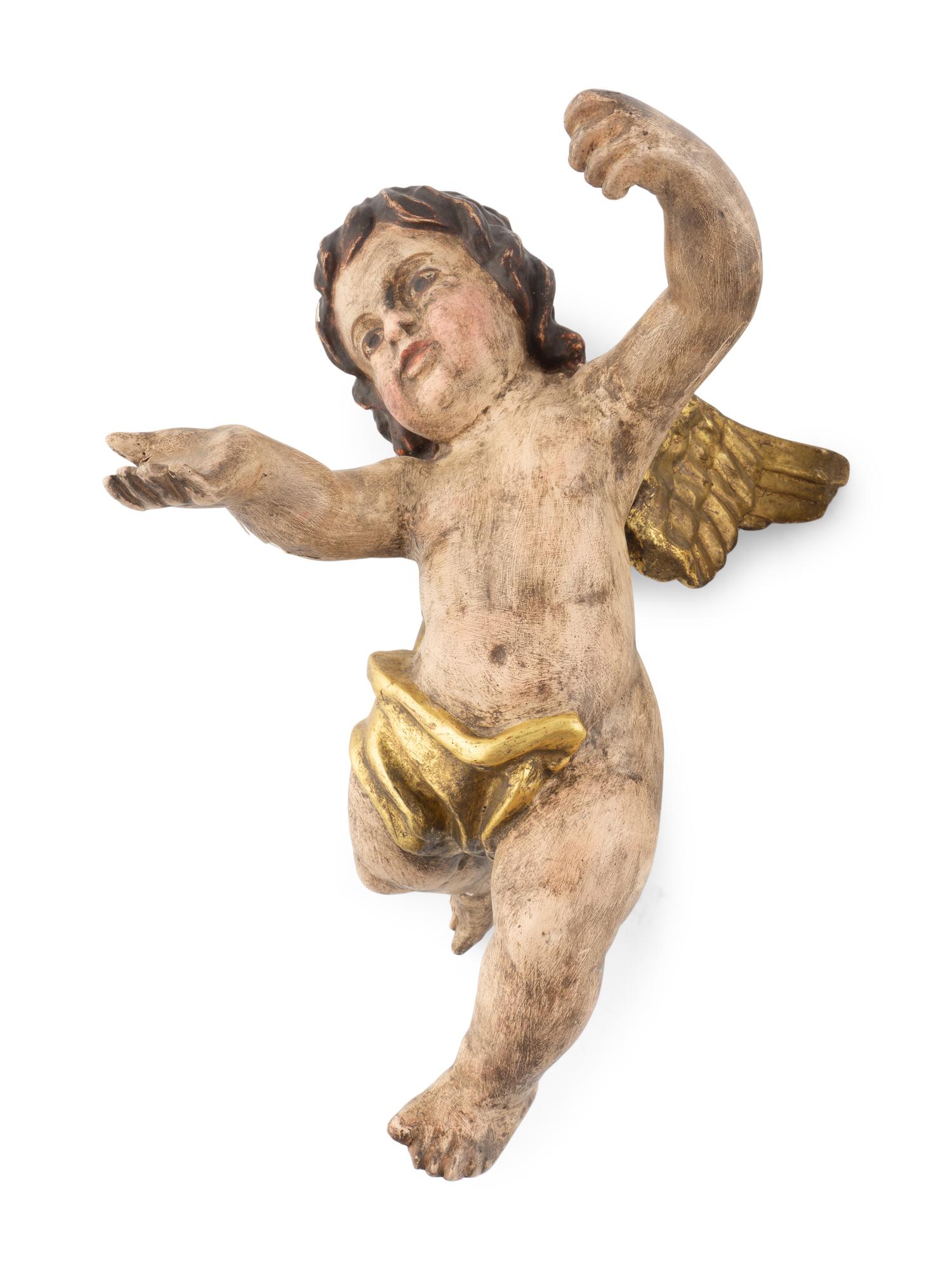 A Pair of Continental Painted and Parcel Gilt Putto Ornaments