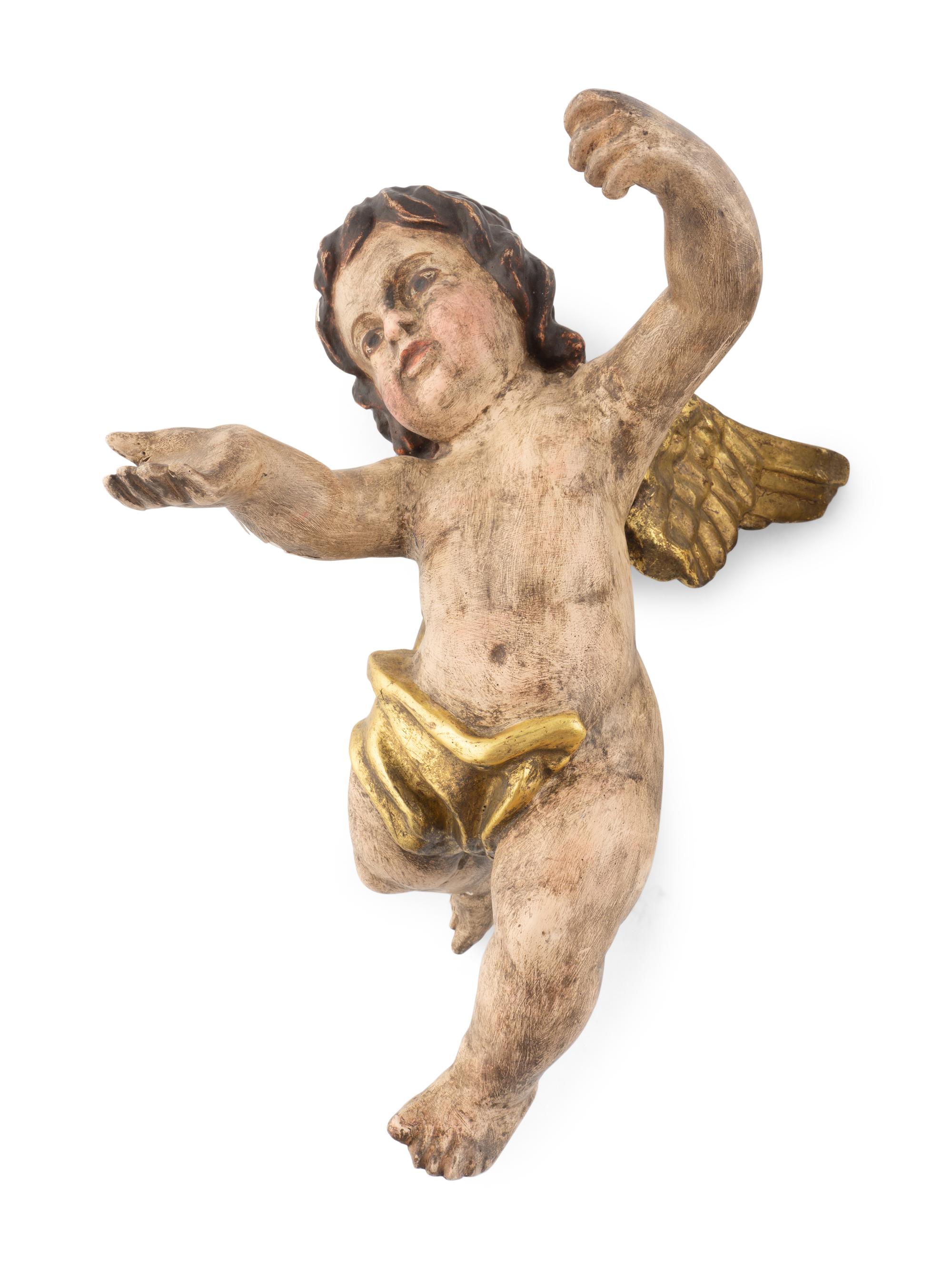A Pair of Continental Painted and Parcel Gilt Putto Ornaments