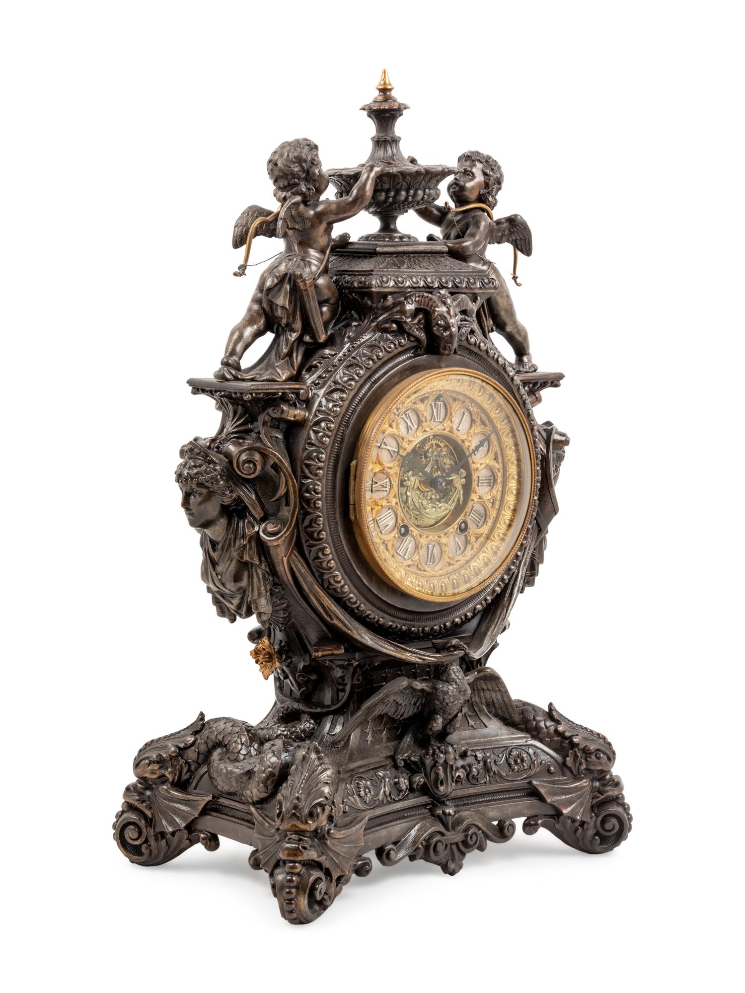 An Ansonia Lydia Patinated Metal Figural Mantel Clock