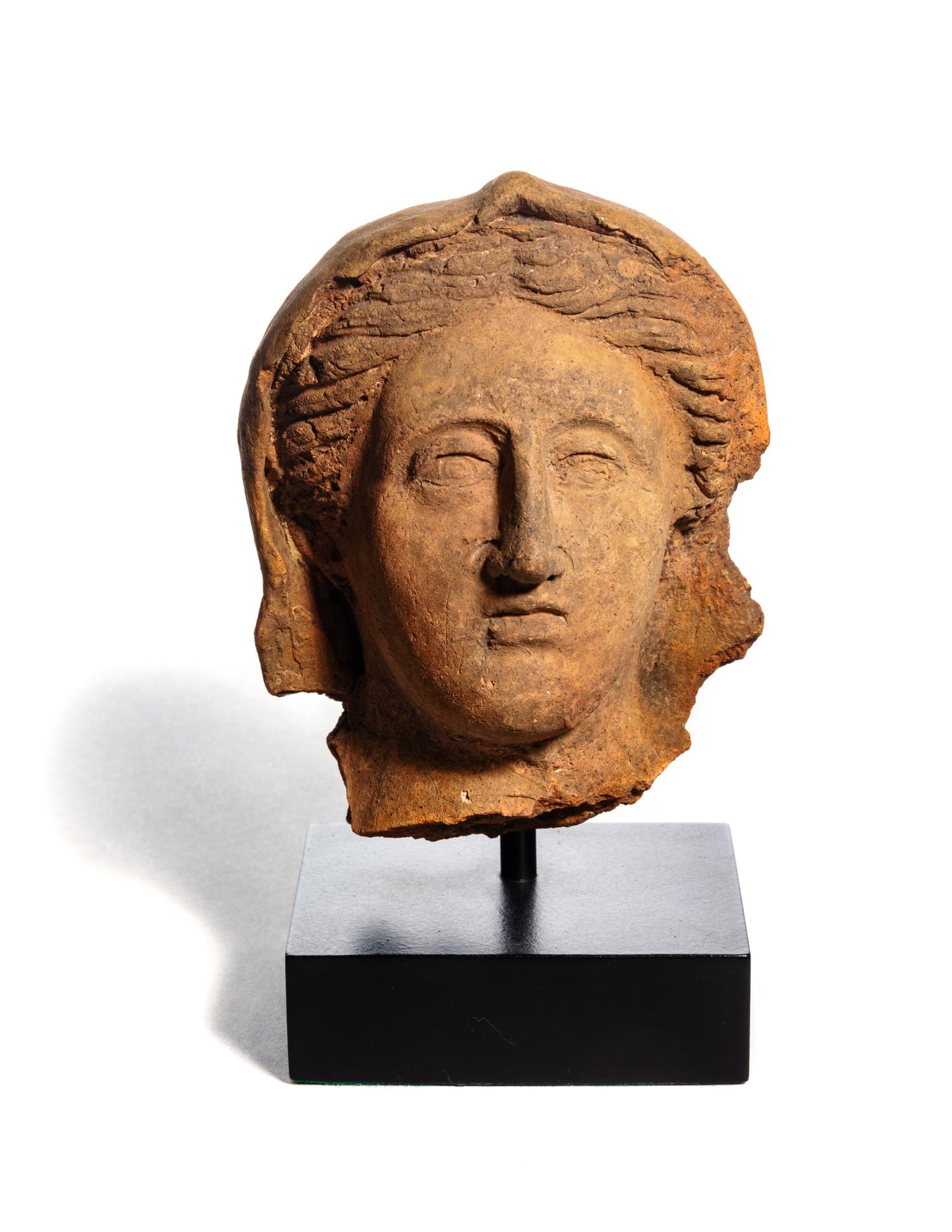 An Etruscan Terra Cotta Votive Head of a Woman