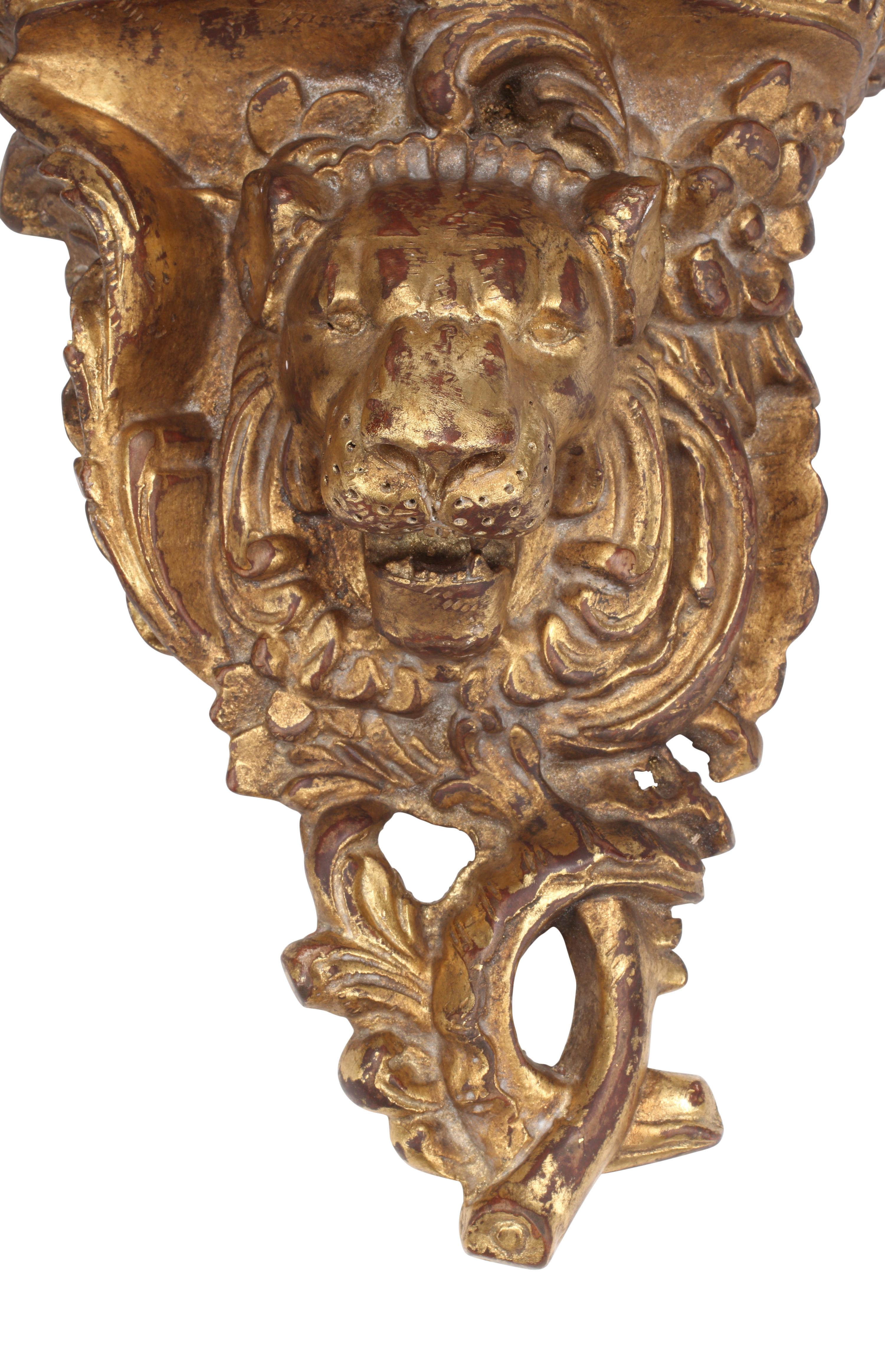 A Pair of Italian Giltwood Lion Motif Wall Brackets
