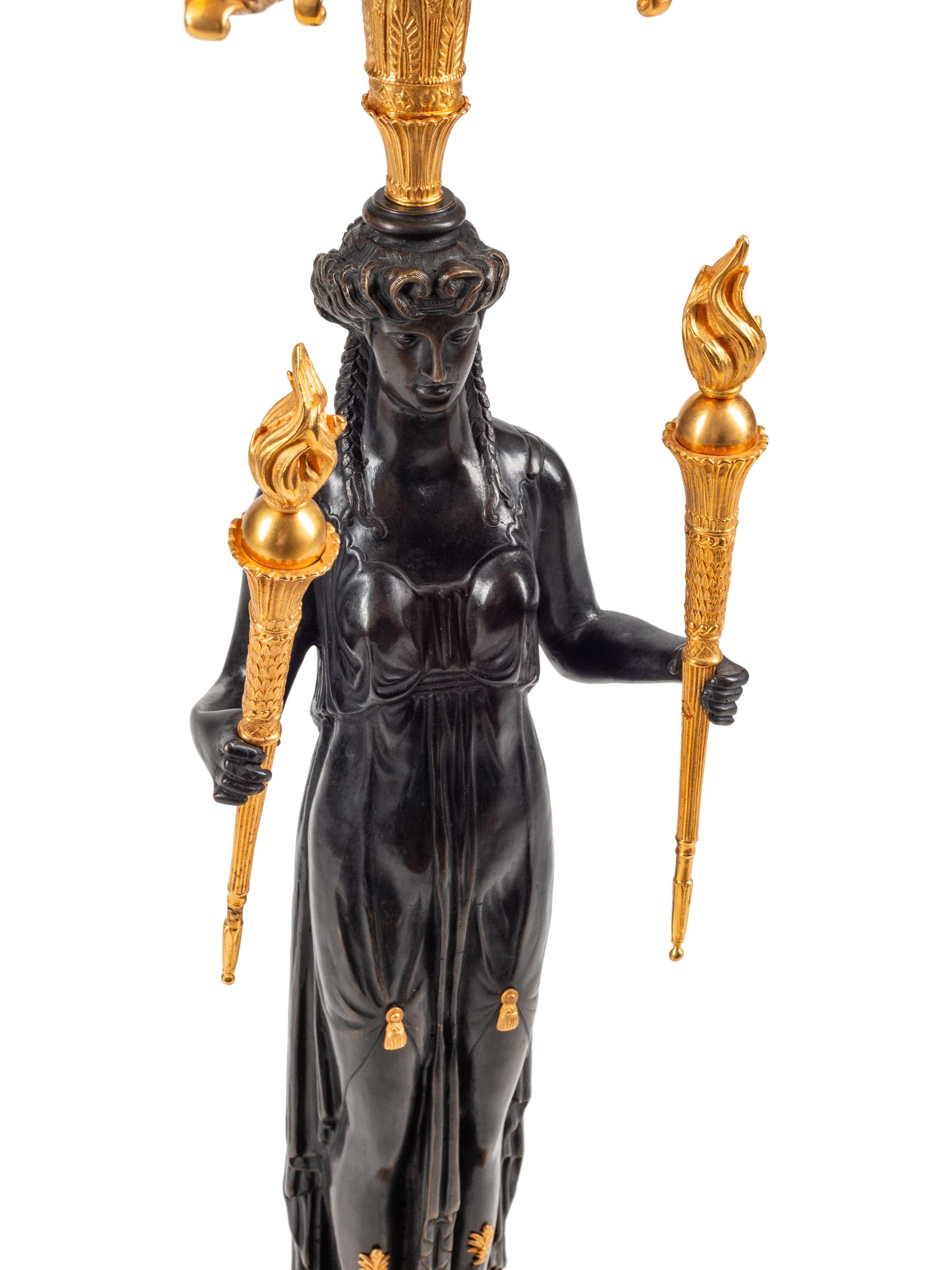 An Empire Style Gilt and Patinated Bronze Eight-Light Candelabrum