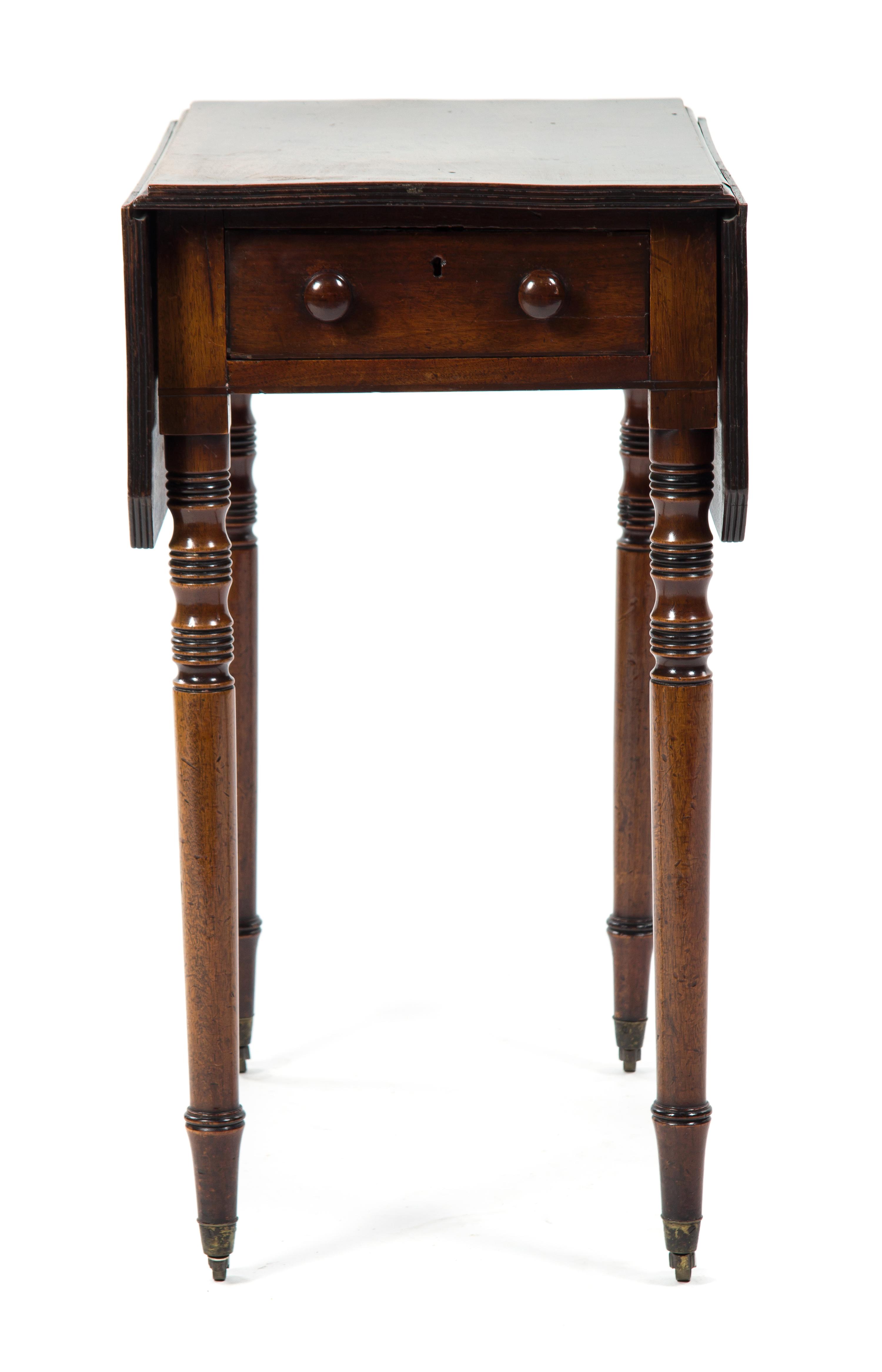 An English Mahogany Pembroke Table, Height 27 1/2 x width 15 x depth 24 inches.
