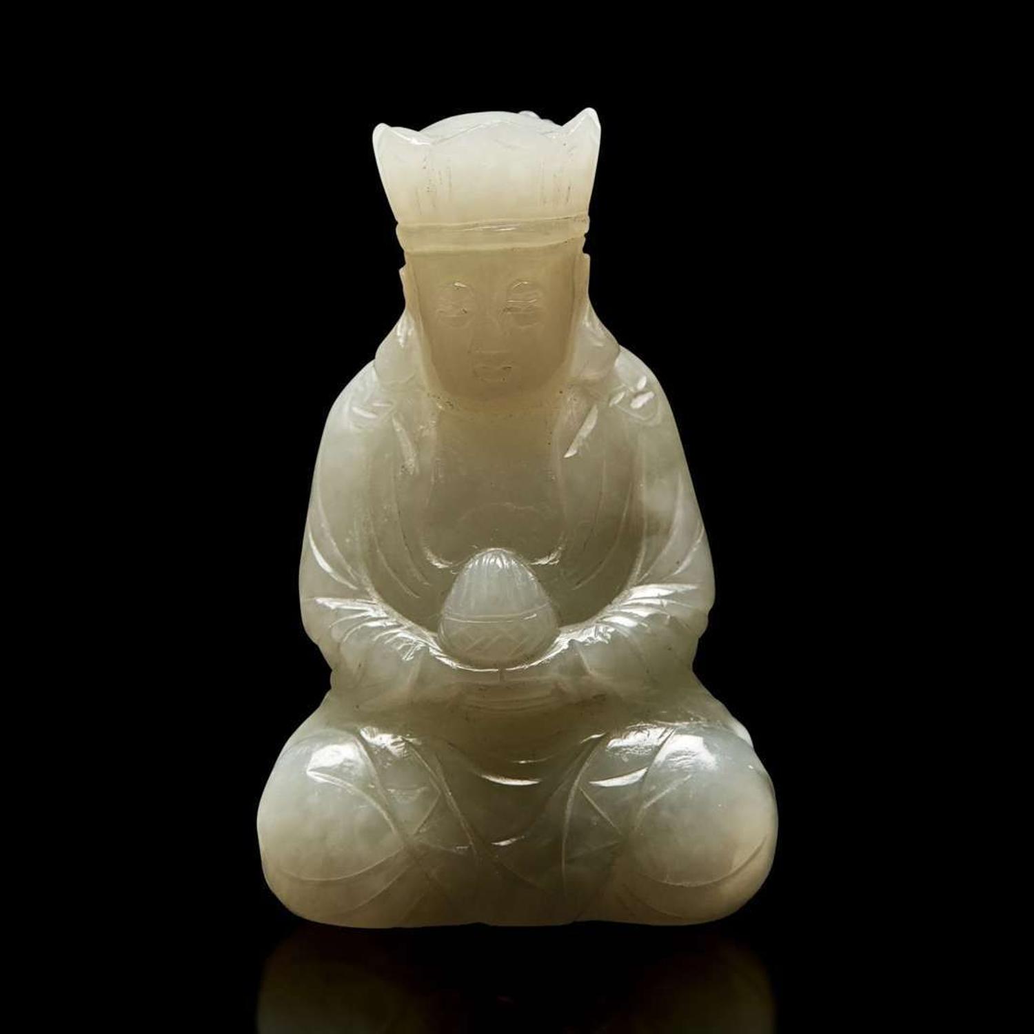 A small Chinese carved pale celadon jade figure of a crowned bodhisattva 青白玉戴冠菩薩