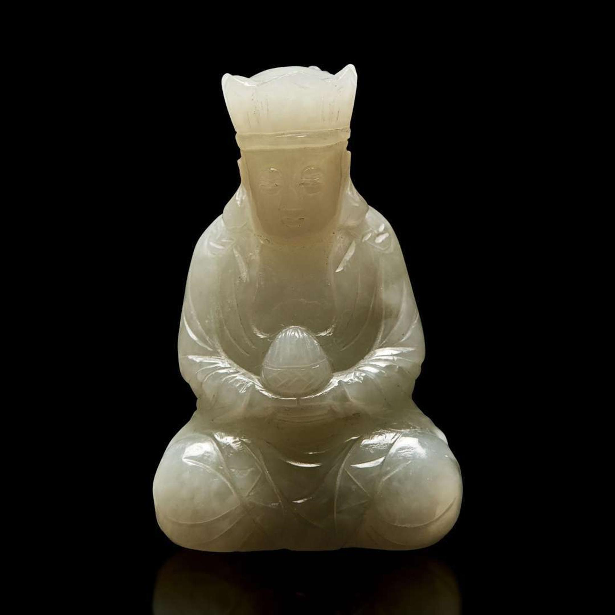 A small Chinese carved pale celadon jade figure of a crowned bodhisattva 青白玉戴冠菩薩