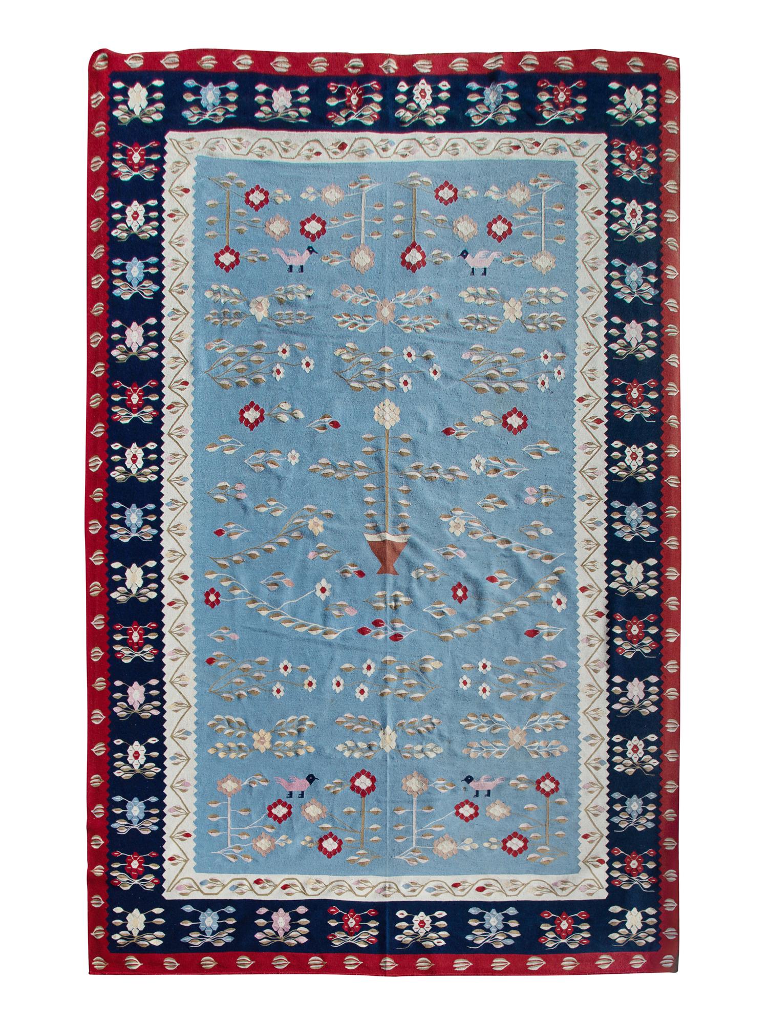 A Flat Weave Rug — 20TH CENTURY