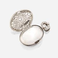 An eighteen karat white gold and diamond pendant locket