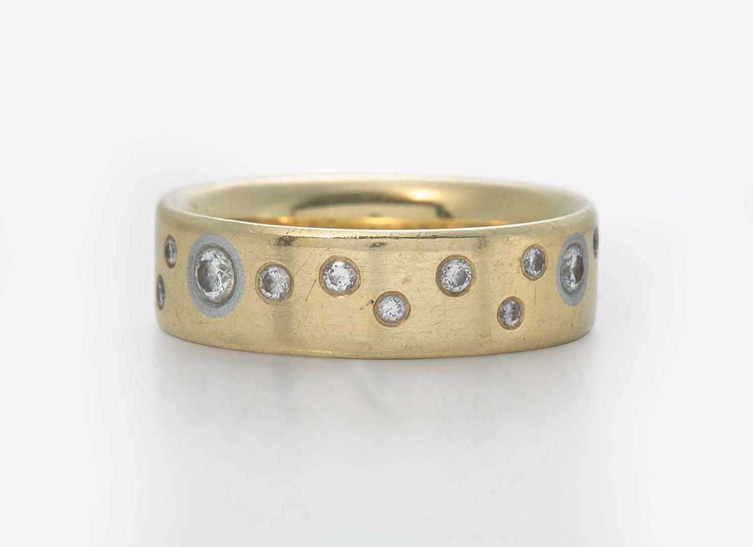 An 18K Yellow Gold Band with Accent Diamonds
