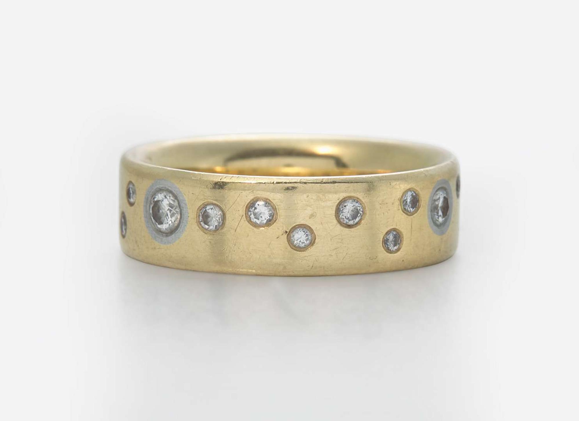 An 18K Yellow Gold Band with Accent Diamonds