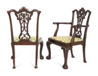 A Set of Eleven George III Style Ribbon-Carved Mahogany Dining Chairs