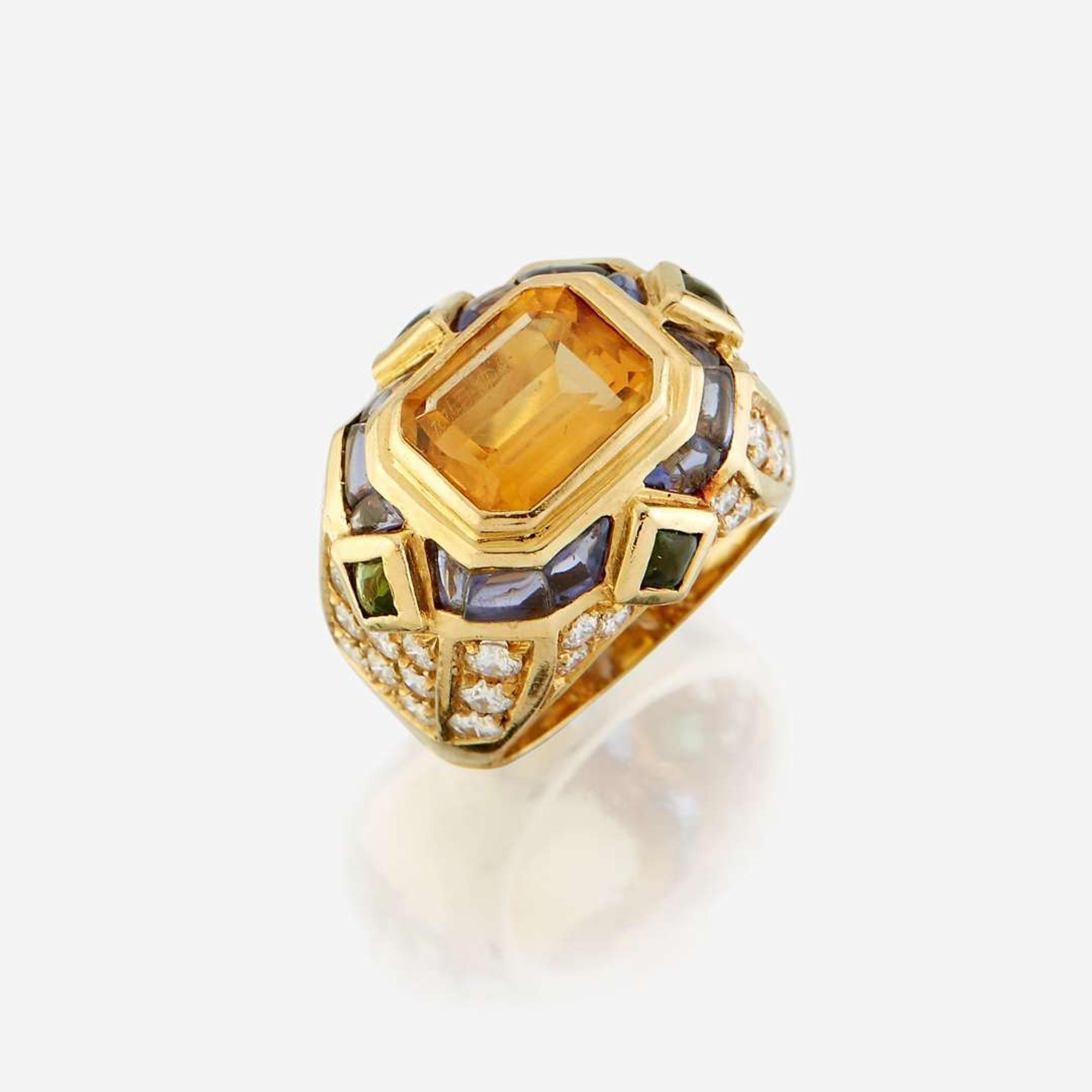 A citrine, diamond, sapphire, peridot, and eighteen karat gold ring