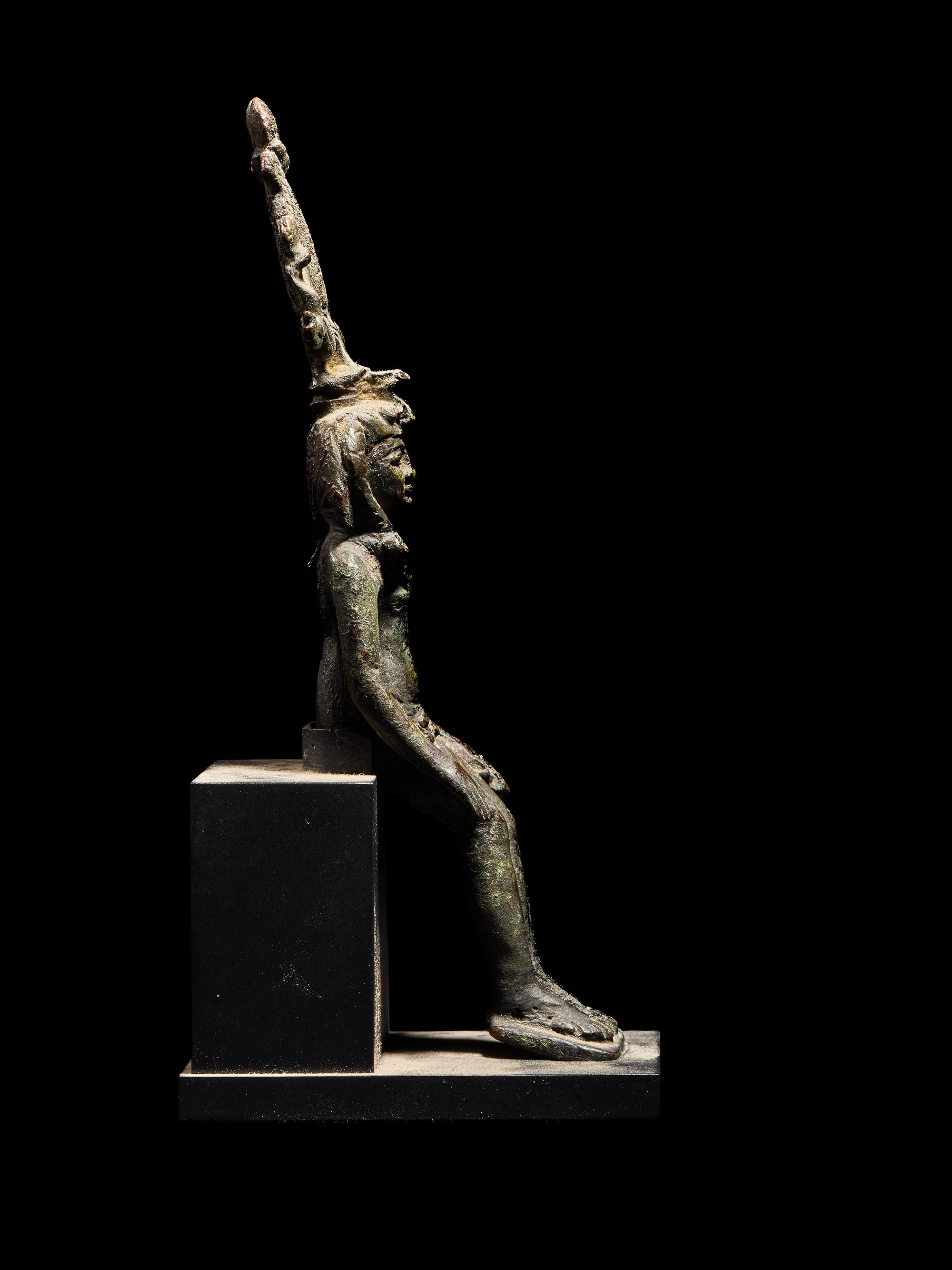 An Egyptian Bronze Seated Harpocrates