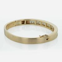 A 14K Yellow Gold and Diamond Bangle Bracelet