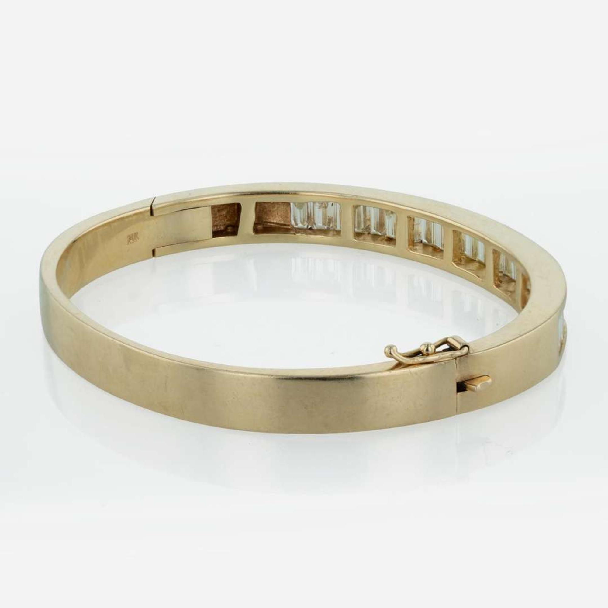 A 14K Yellow Gold and Diamond Bangle Bracelet