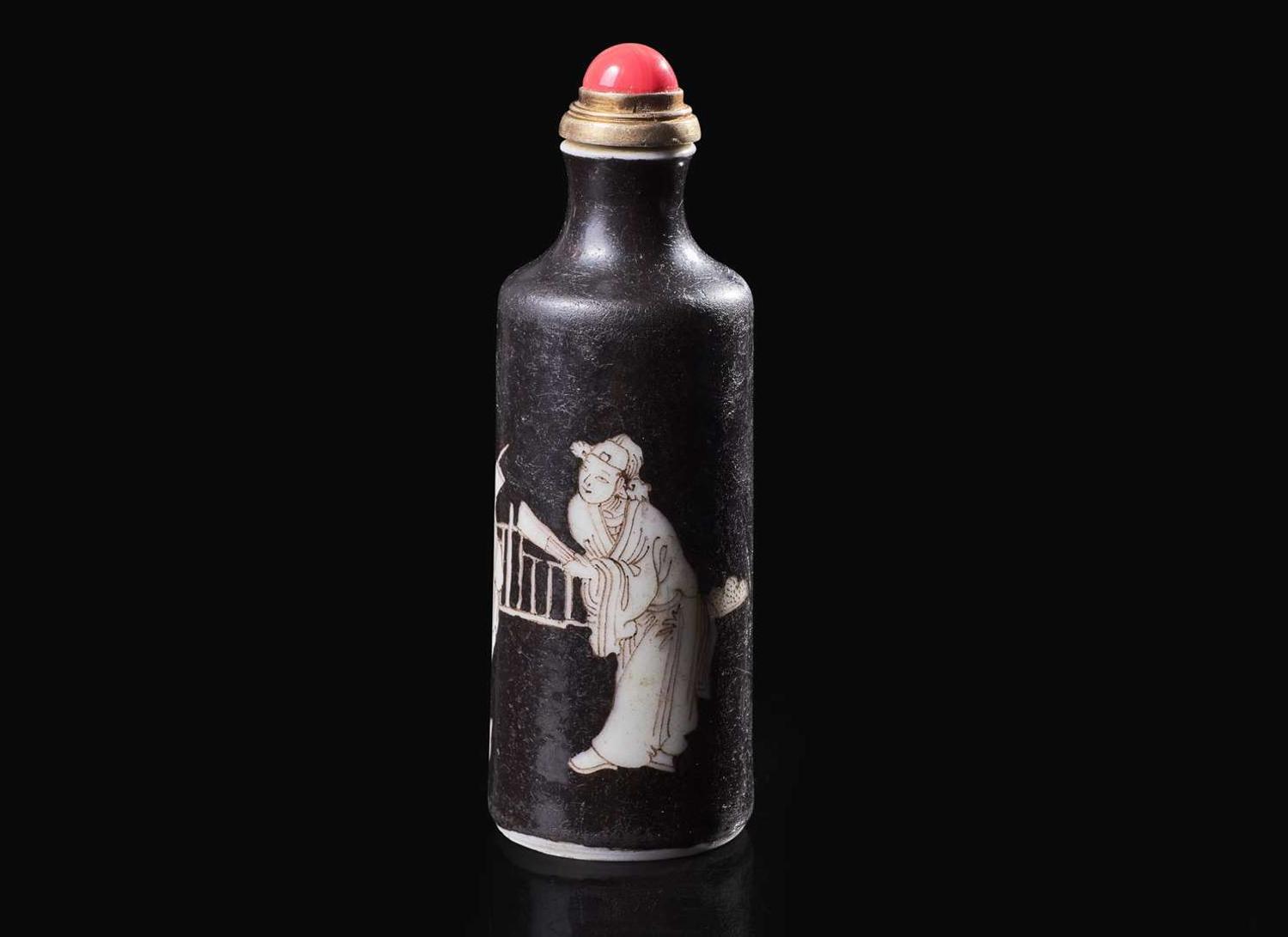 A Chinese black-ground porcelain snuff bottle, Daoguang mark and of the period 黑釉鼻煙壺 道光款 清 道光