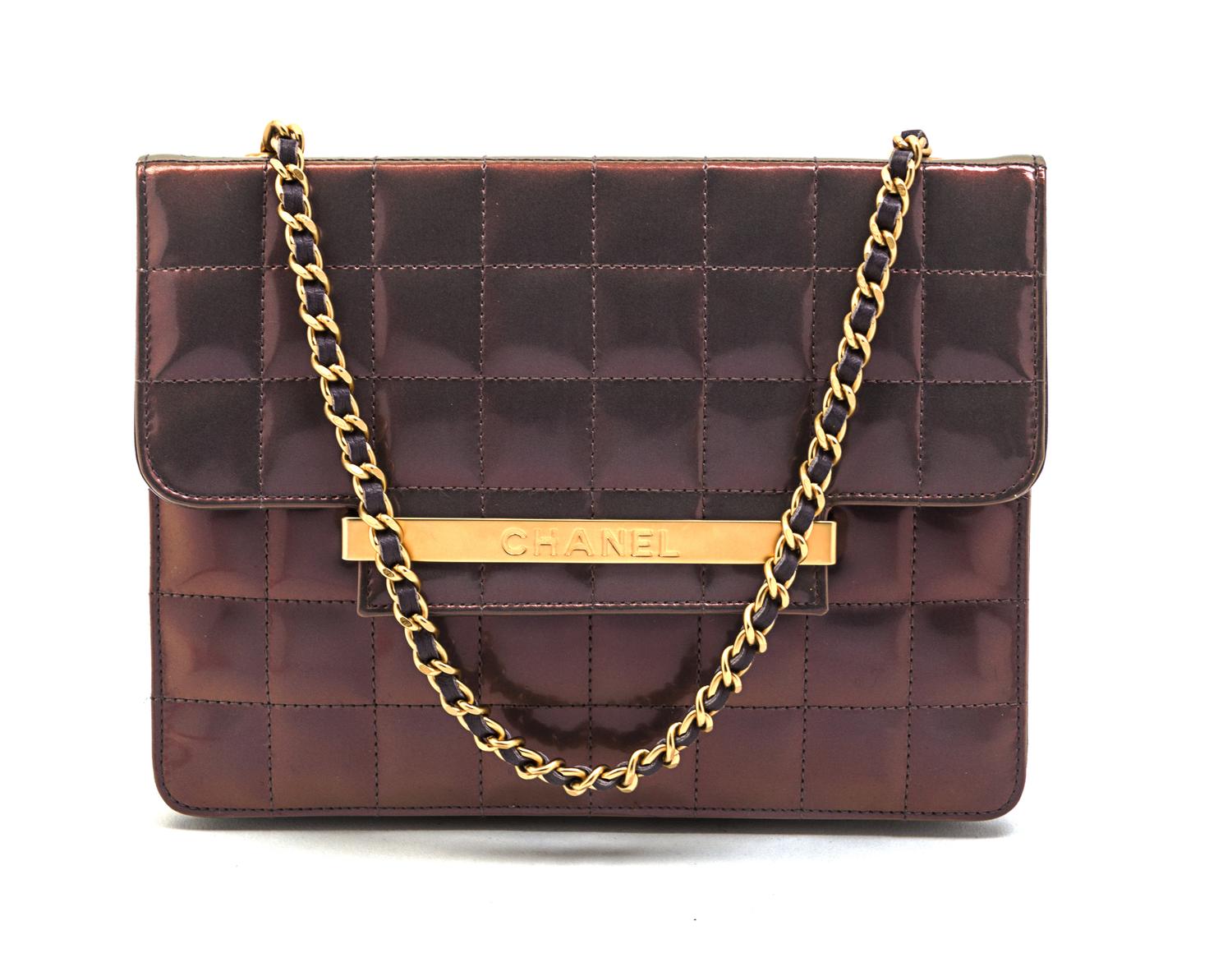 A Chanel Iridescent Purple Quilted Flap Bag, 8 x 6 x 1 inches.