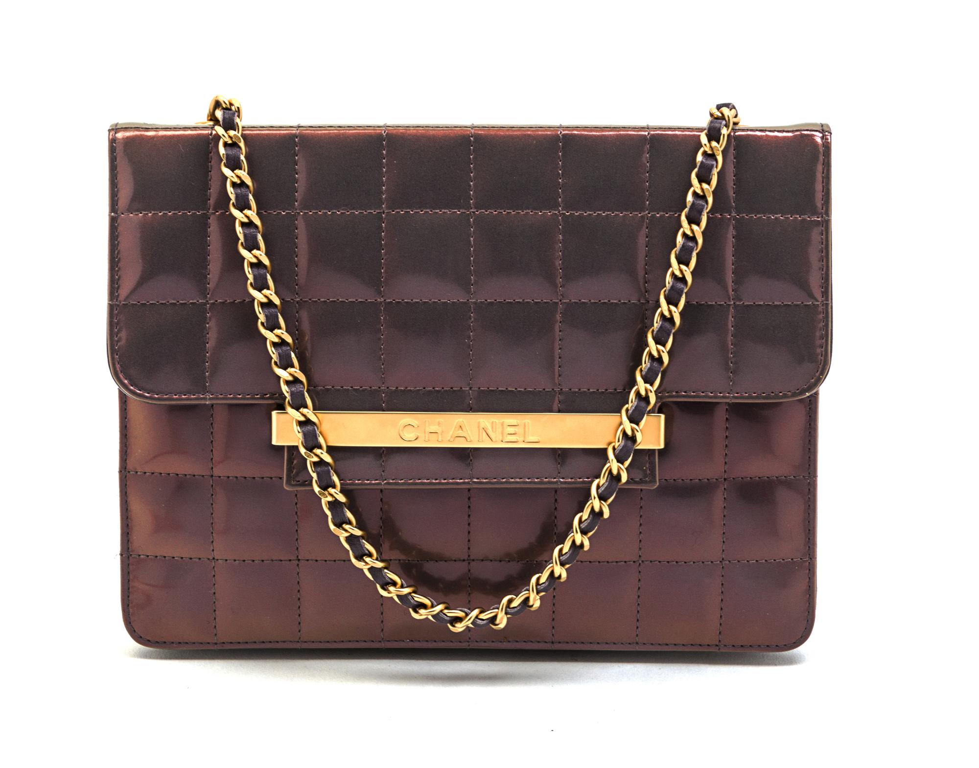 A Chanel Iridescent Purple Quilted Flap Bag, 8 x 6 x 1 inches.