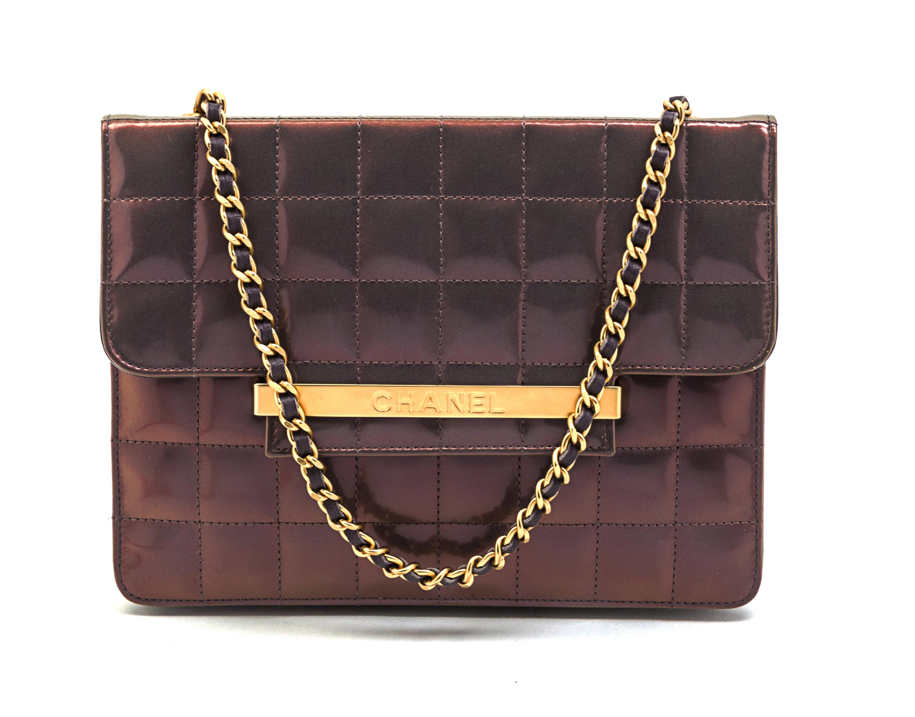 A Chanel Iridescent Purple Quilted Flap Bag, 8 x 6 x 1 inches.