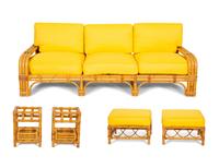 A Bielecky Brothers Rattan Settee with Two End Tables and a Pair of Ottomans