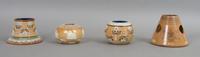 A Group of Four Doulton Match Strikes, Height of tallest 3 3/4 inches.
