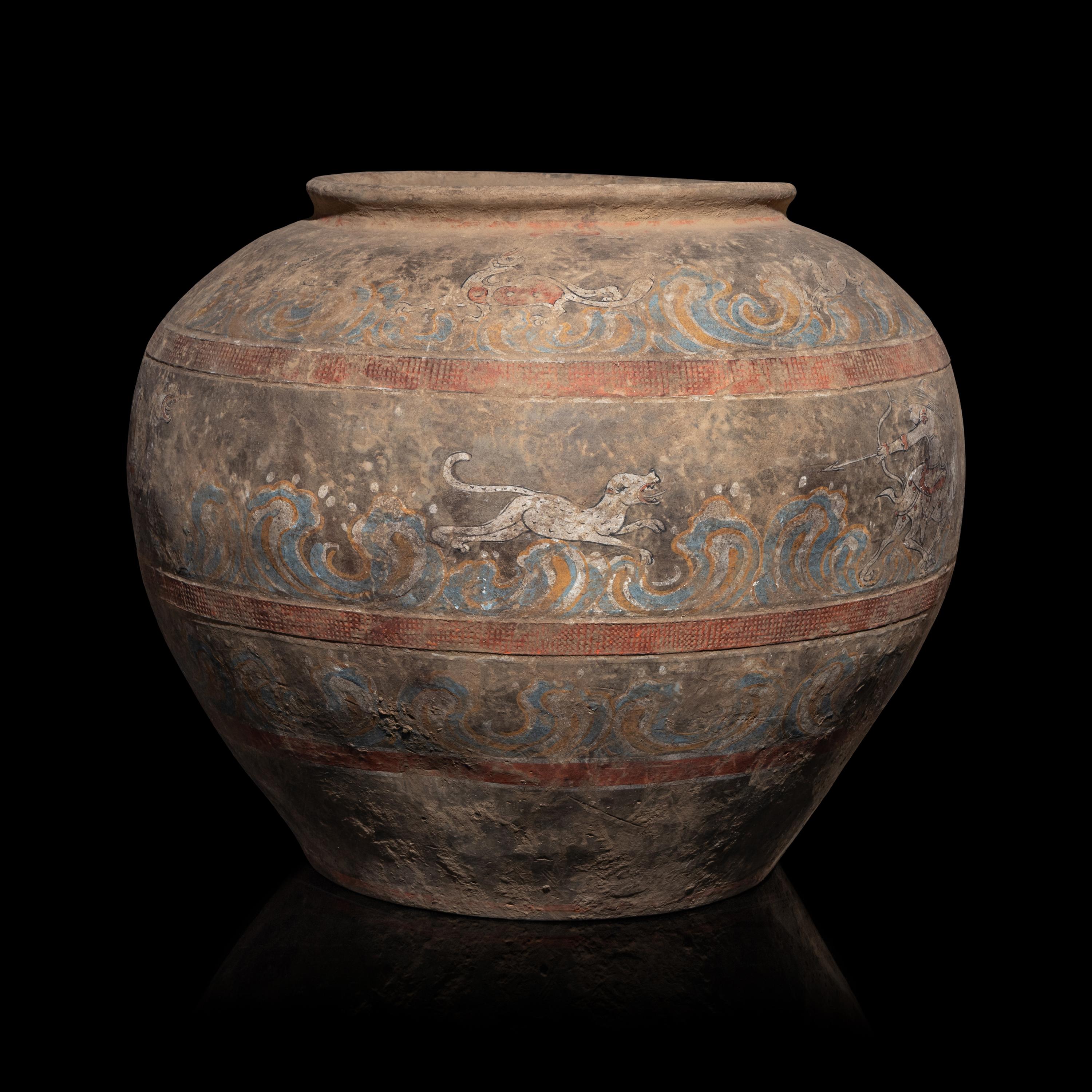 A Chinese Painted Pottery 'Mythical Beast' Jar, Han Dynasty — 漢 灰陶彩繪狩獵圖大罐