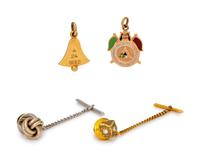 A Collection of Gold Tie Tacks and Charms,