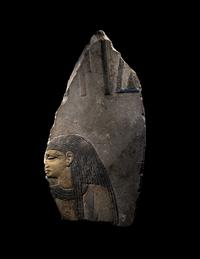 An Egyptian Painted Limestone Relief Fragment