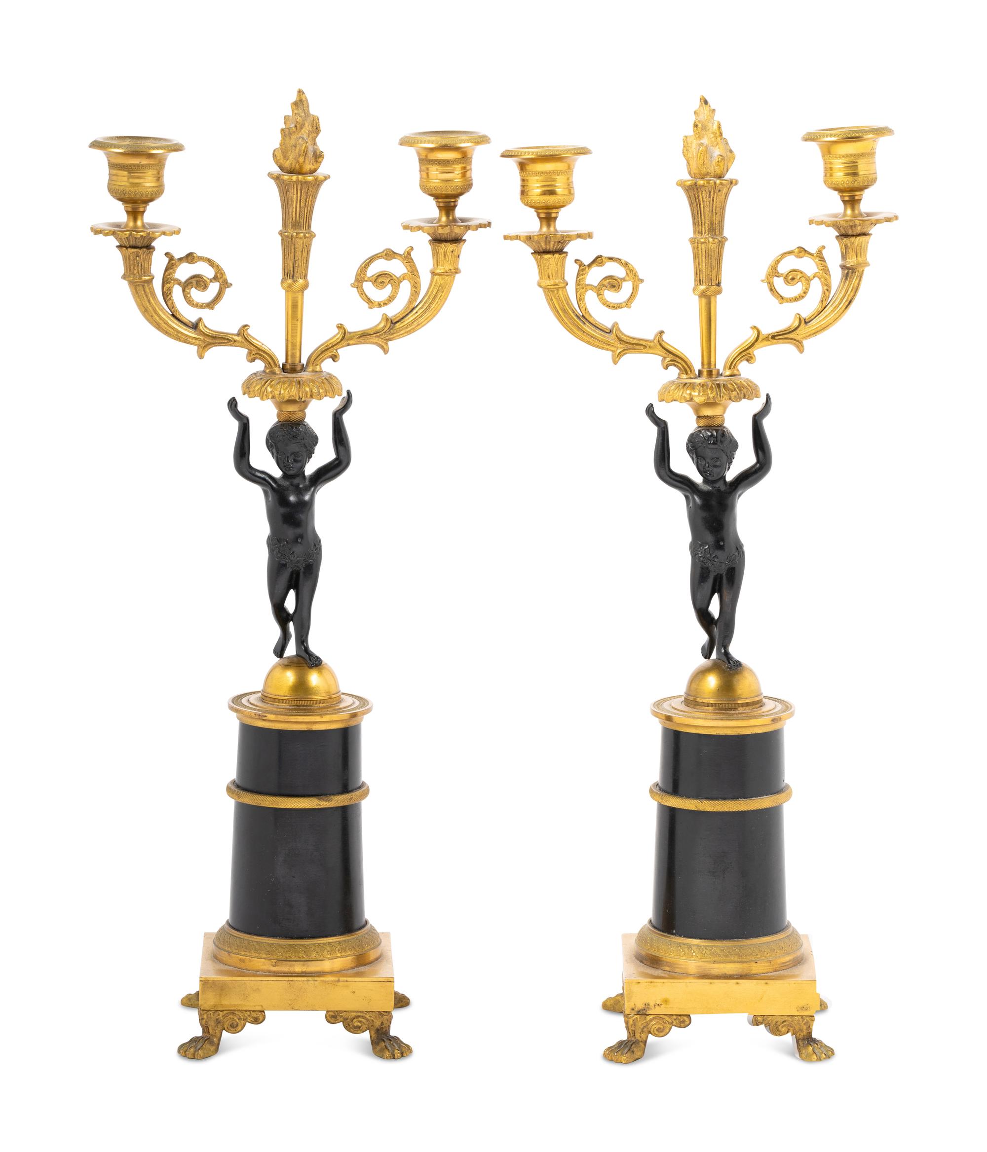 A Pair of Empire Style Parcel Gilt Metal Two-Light Candelabra