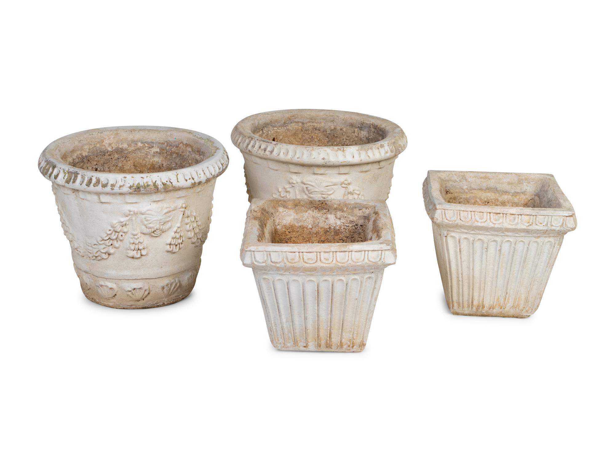 A Collection of Four Cast Stone Jardinières