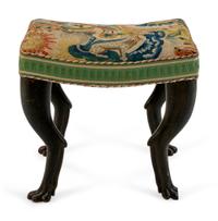 An Italian Carved and Ebonized Bench — 19TH/20TH CENTURY