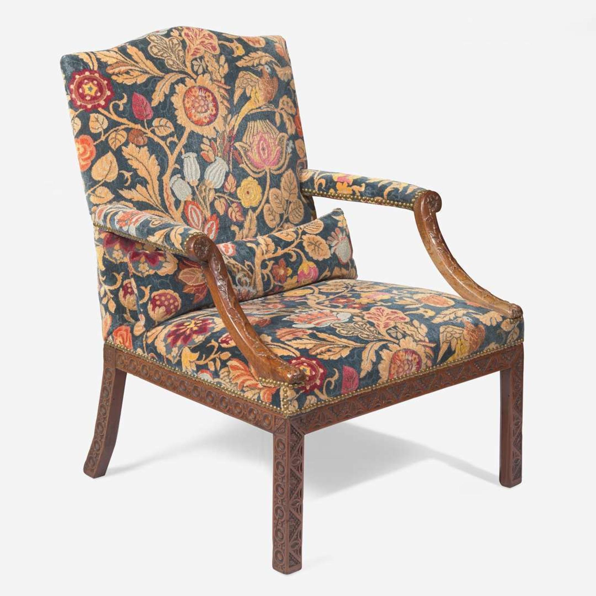 A George III carved walnut library armchair circa 1765