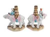A Pair of Continental Porcelain Figural Candlesticks