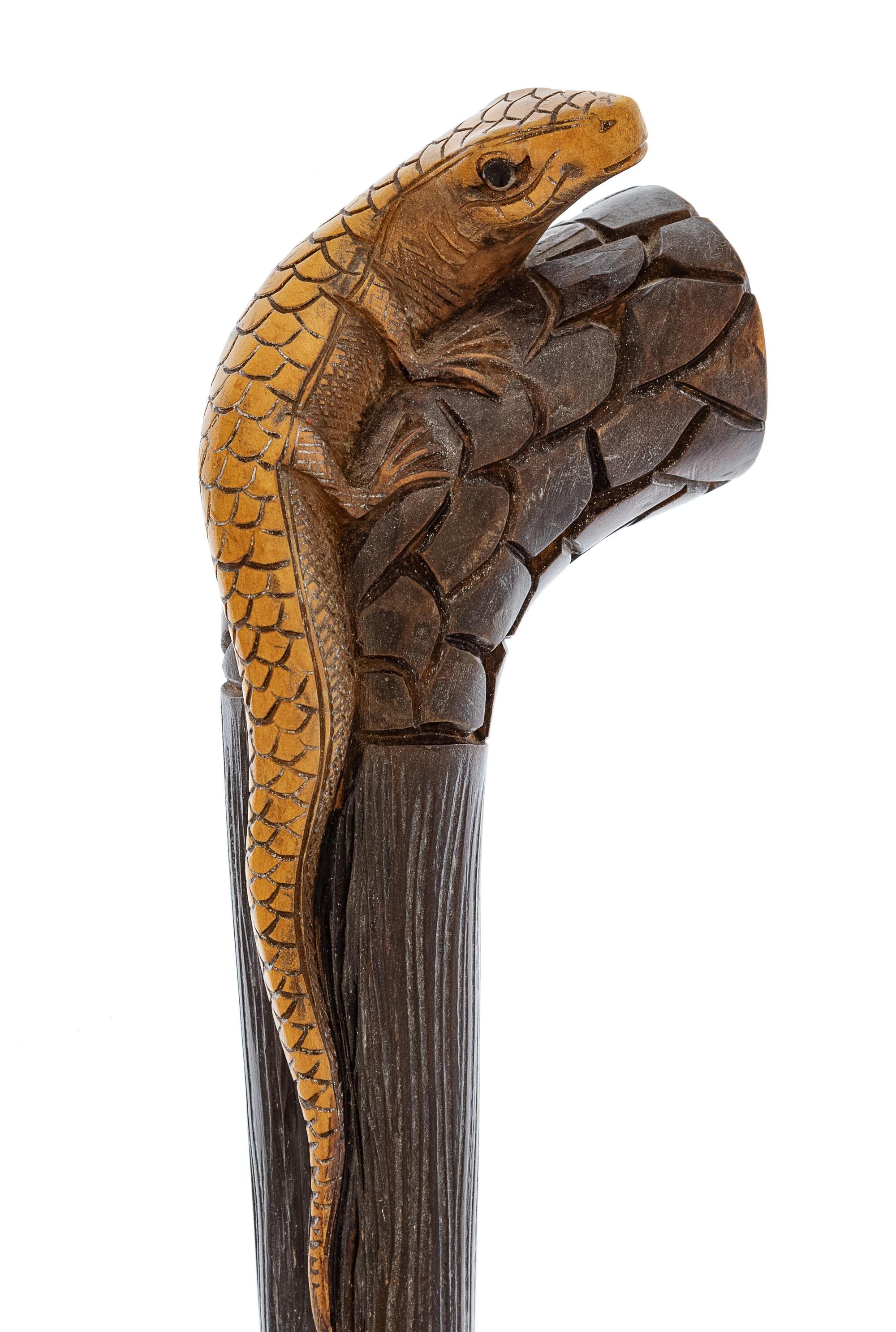 A Carved Wood Zoomorphic Walking Stick
