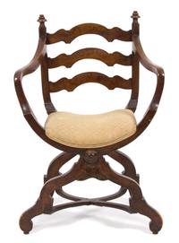 A Continental Savonarola Style Walnut Curule Ladder Back Armchair Height 37 inches. — 19TH CENTURY