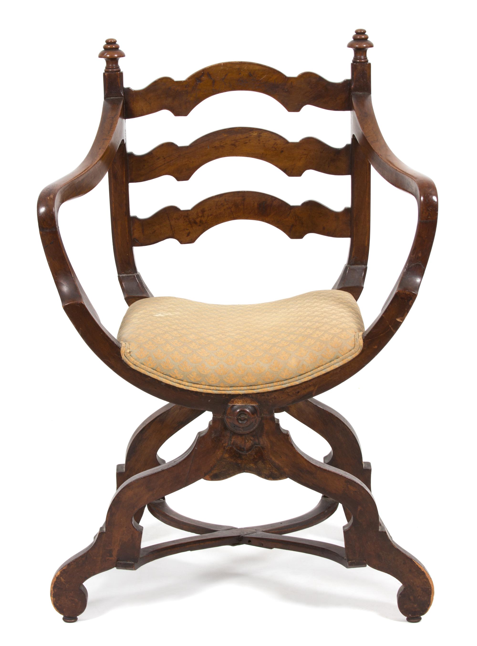 A Continental Savonarola Style Walnut Curule Ladder Back Armchair Height 37 inches. — 19TH CENTURY