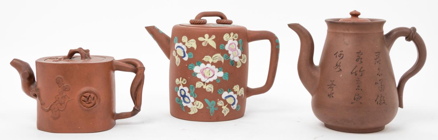 Three Chinese Yixing Pottery Tea Pots Height of the largest 6 1/4 inches.