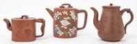 Three Chinese Yixing Pottery Tea Pots Height of the largest 6 1/4 inches.