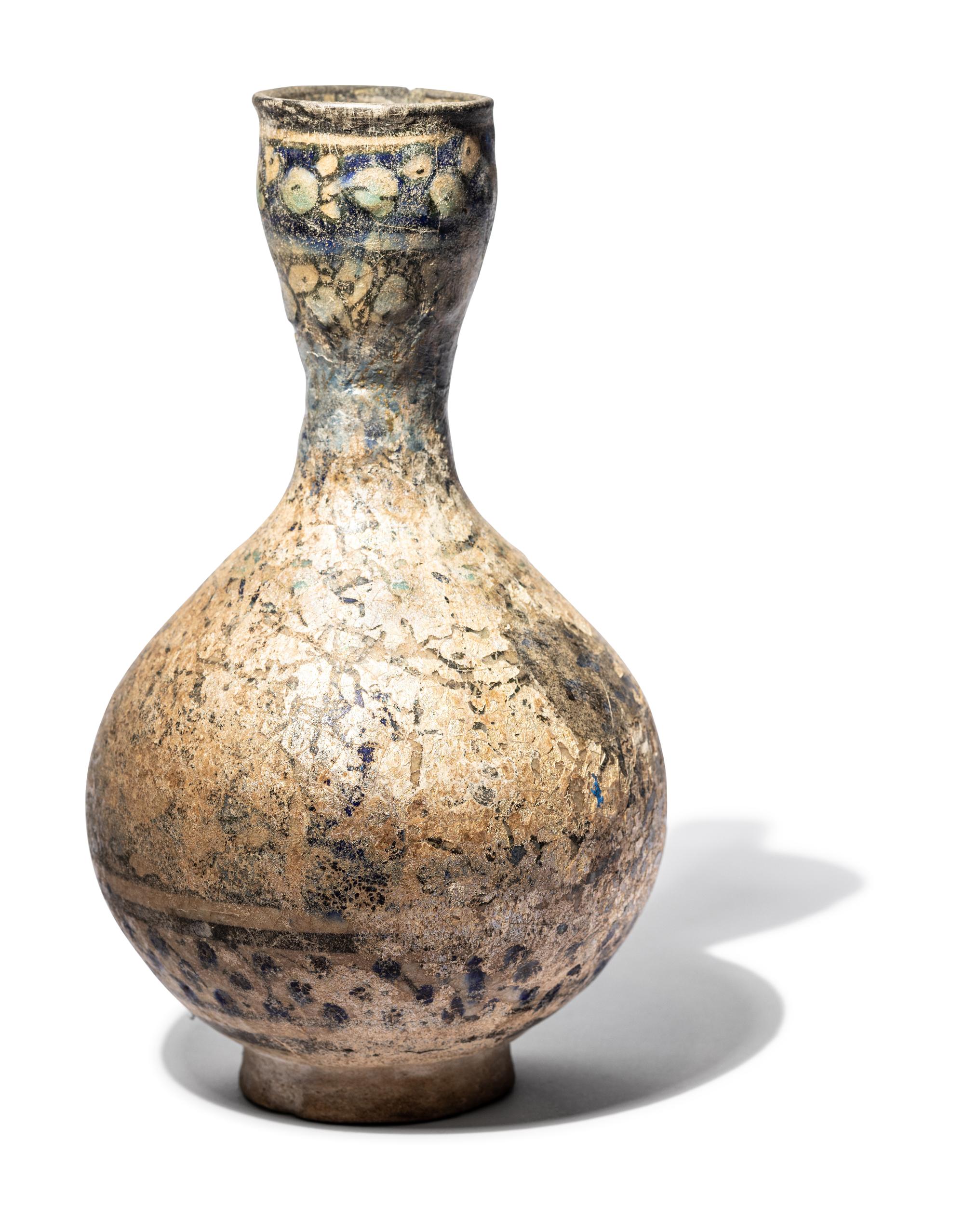 A Ilkhanid Clear-Glazed Ewer