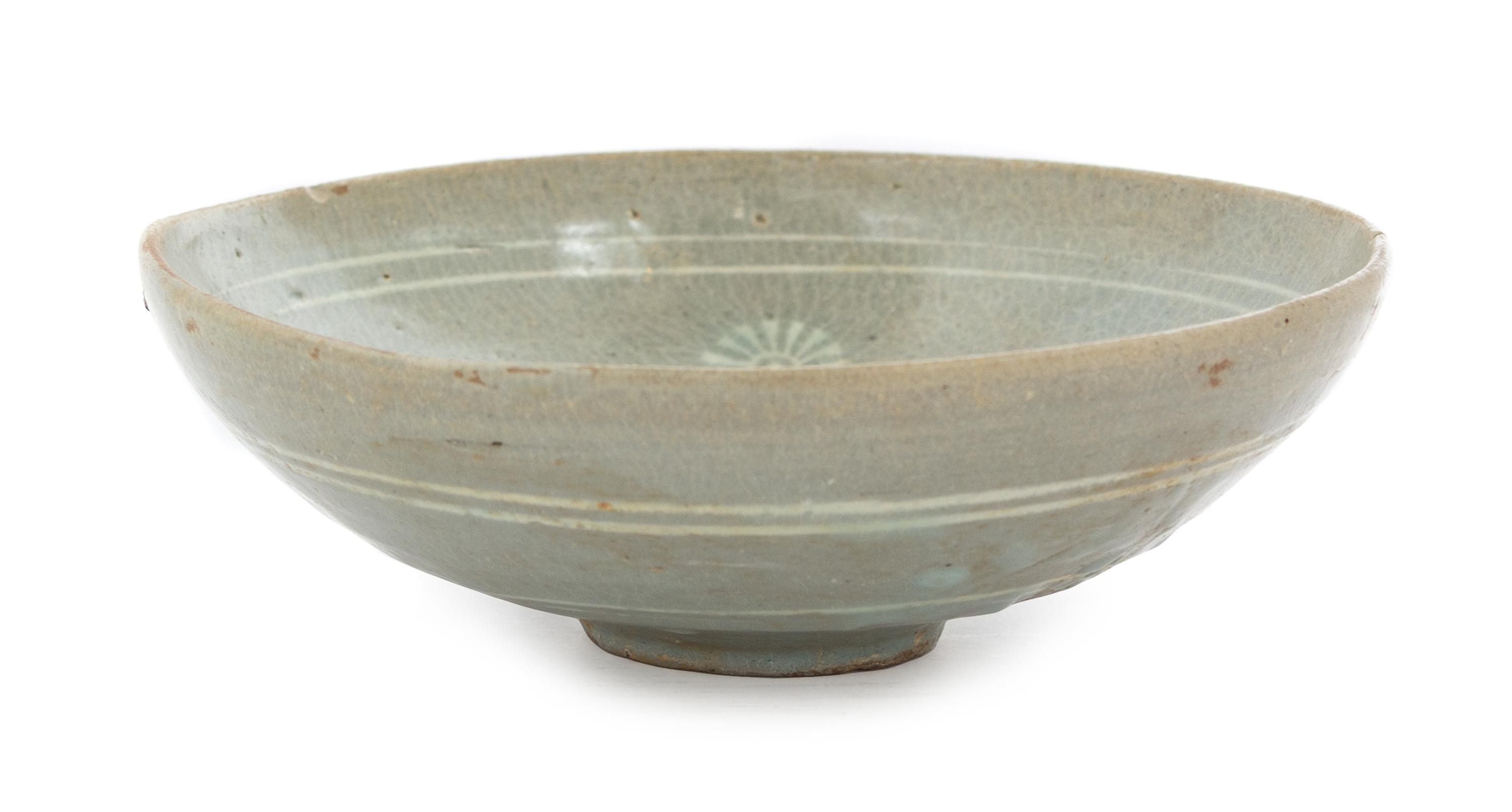 A Korean Celadon Glazed Stoneware Bowl KORYO DYNASTY, 13TH/14TH CENTURY Diameter 7 1/4 inches. — KORYO DYNASTY, 13TH/14TH CENTURY
