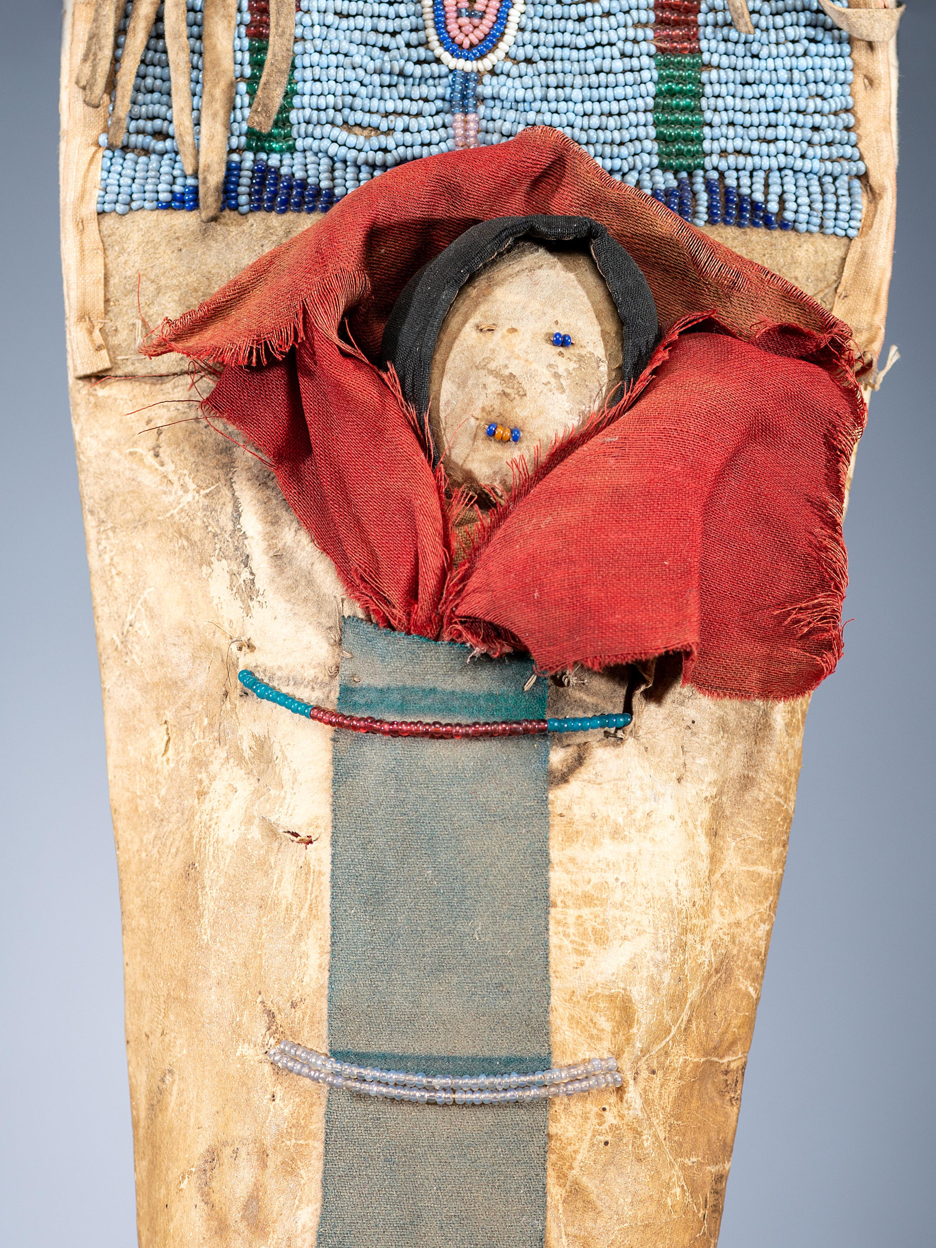 Nez Perce Beaded Hide Pictorial Toy Cradle, with Doll