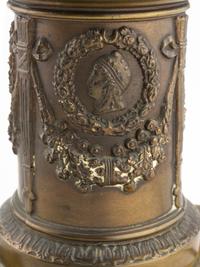 A Pair of Empire Style Parcel Gilt and Patinated Metal Six-Light Candelabra
