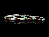 Four Chinese Metal Mounted Jadeite Bangles